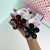 کلیپس طرح گل مشکی قهوه ای